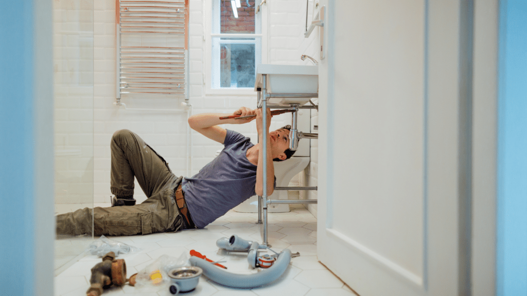 man attempting a diy plumbing repair