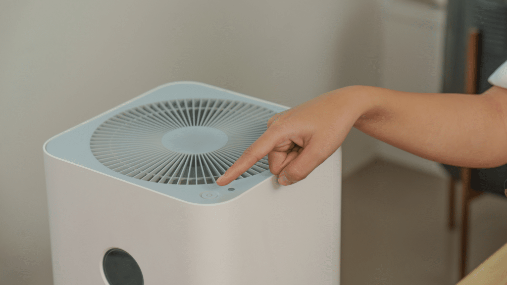 person using an air purifier
