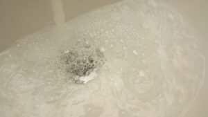 slow drain with water backing up