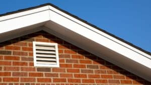 exterior air vent on a brick house